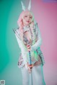 A woman in a bunny costume holding a sword.